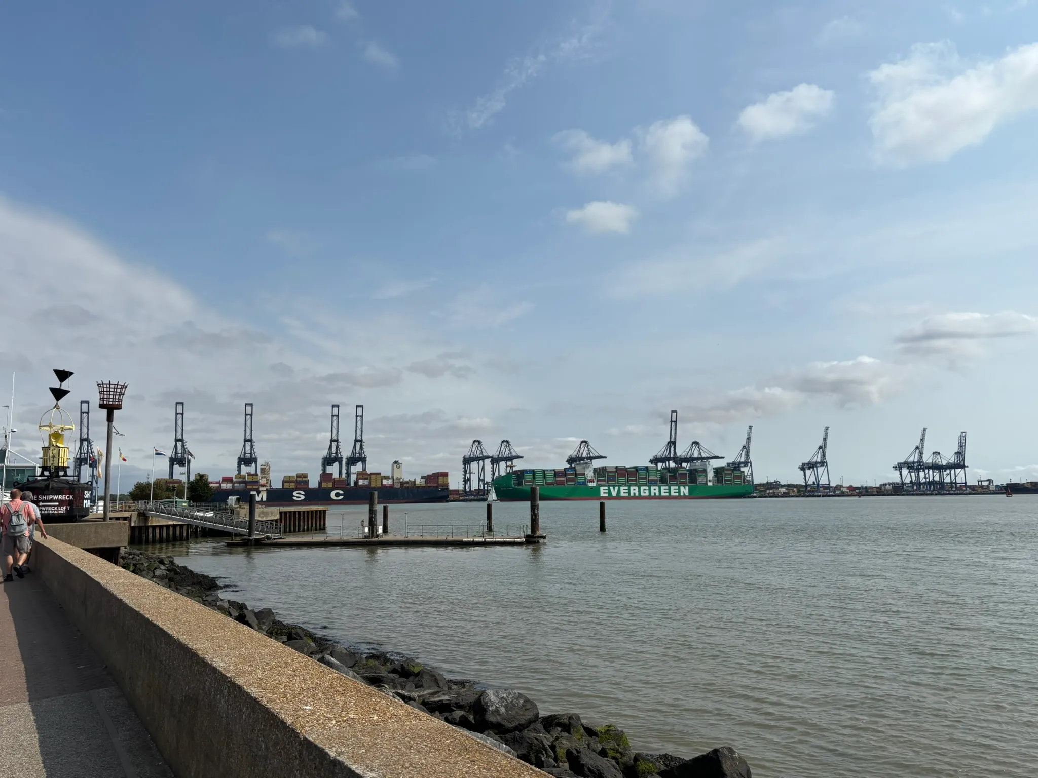 Container ships and cranes at the Port of Felixstowe viewed across Harwich Haven from Shotley.