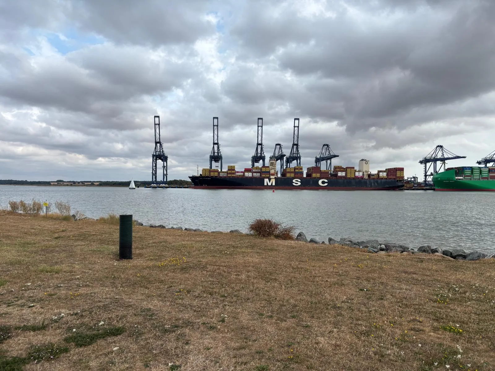 Container ship being unloaded at the Port of Felixstowe across Harwich Haven.
