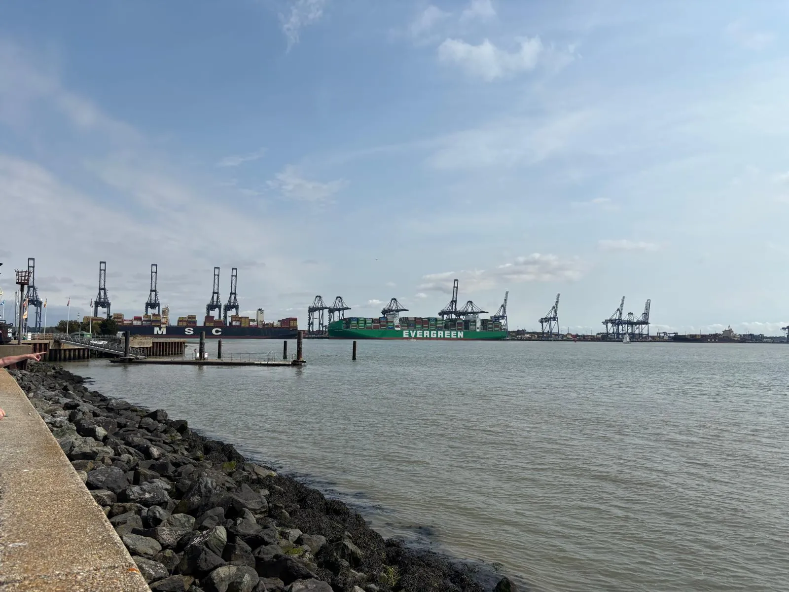 Port of Felixstowe container ships and cranes viewed across Harwich Haven from Shotley.