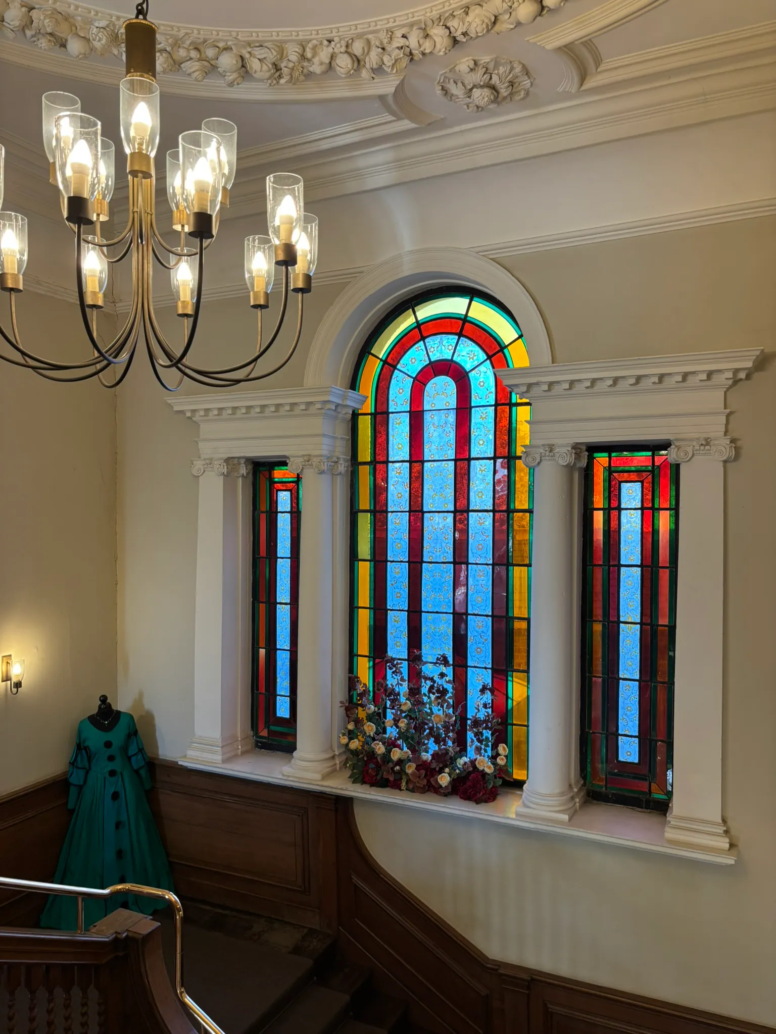 Colourful stained-glass window and ornate interior at Valentines Mansion.