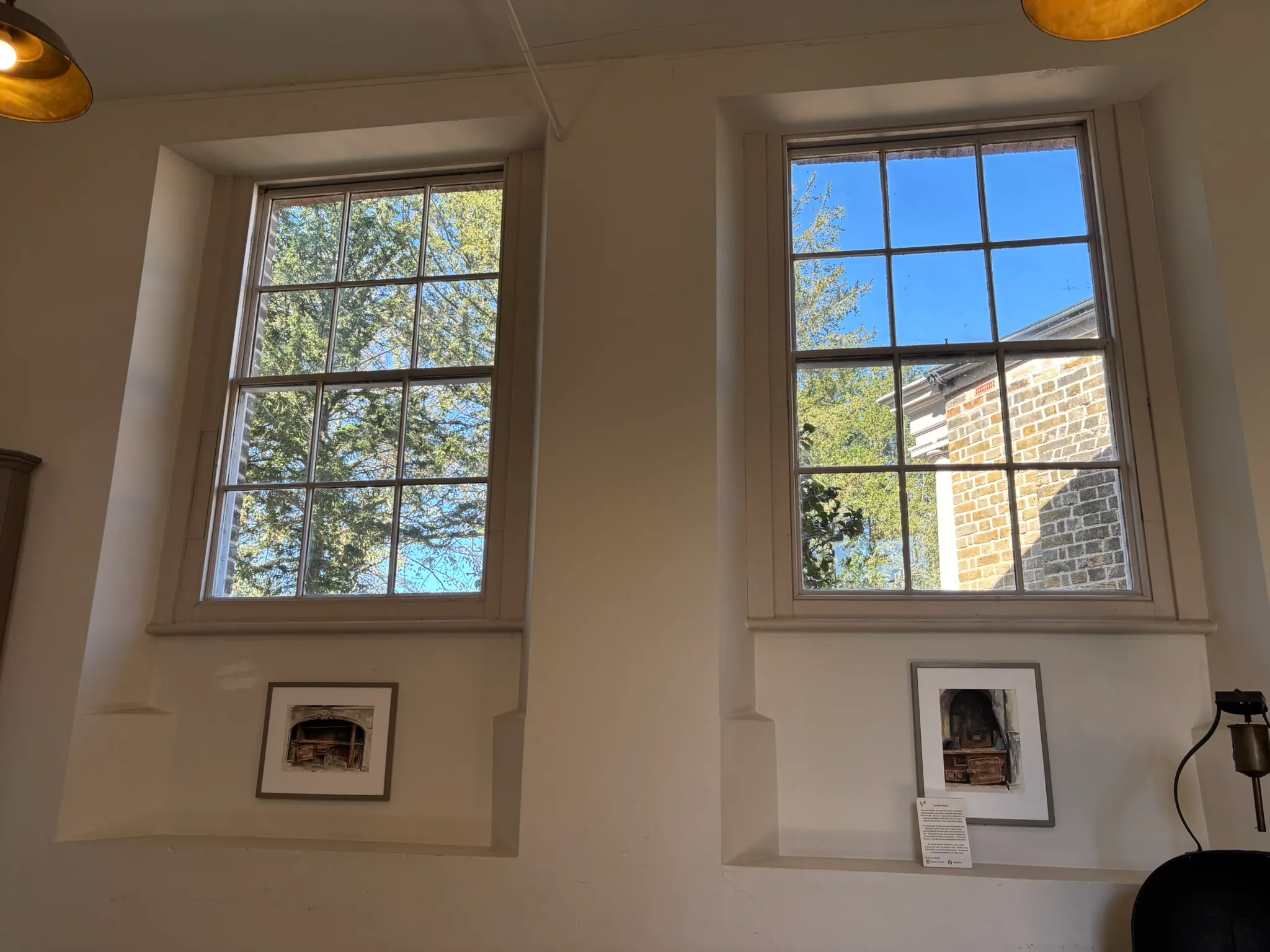Tall sash windows inside Valentines Mansion overlooking the gardens.
